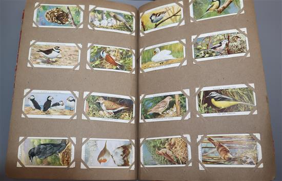 An album of cigarette cards, including Players Cricketers 1930 and 1934 (50), Cage and Aviary Birds, etc. (approx15 sets/part sets)